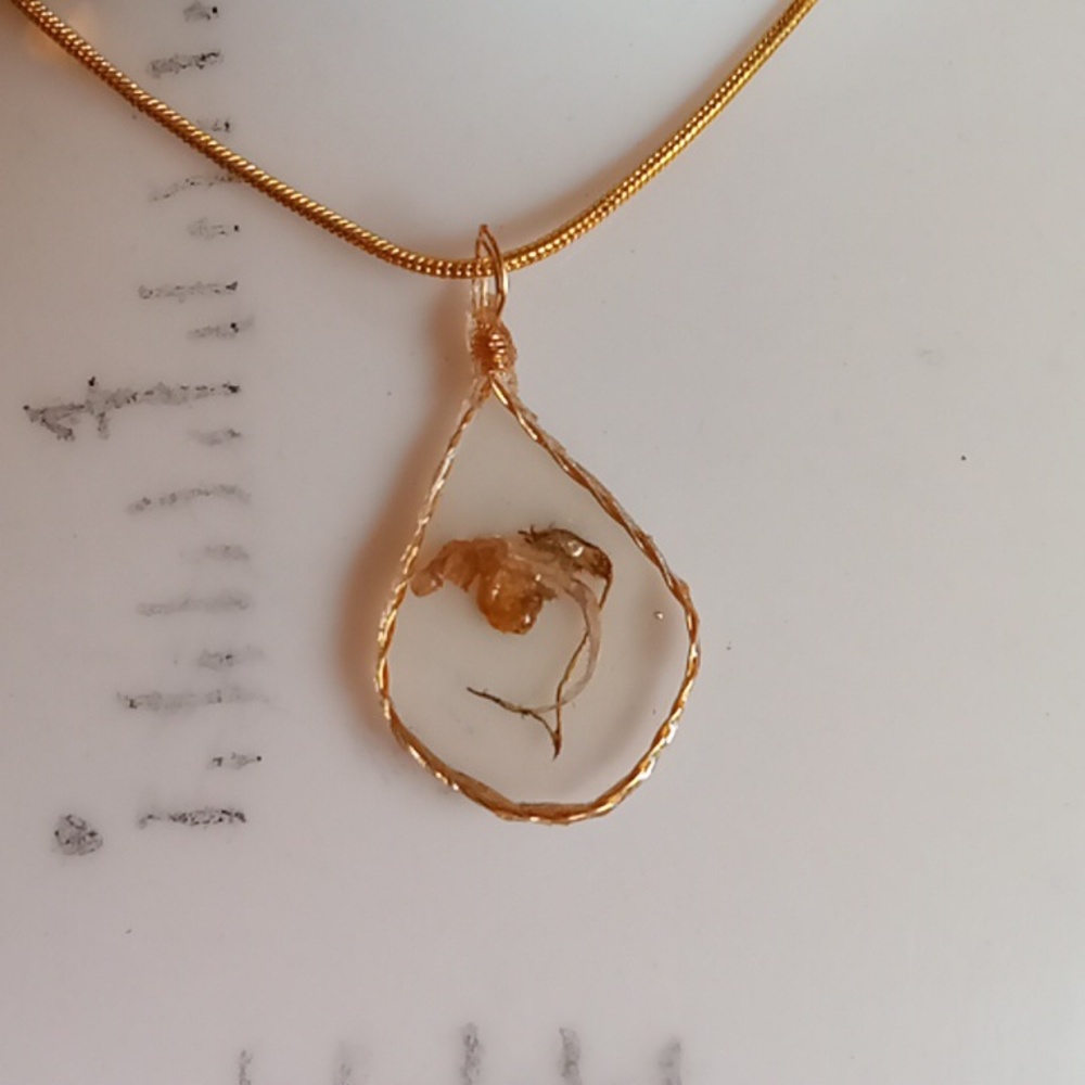Floral necklace, amulet